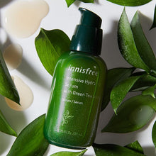 Load image into Gallery viewer, Our global best-selling lightweight yet nourishing serum instantly replenishes your skin’s moisture for a soft, glowing complexion. Formulated with a blend of Jeju Green Tea Extract and Green Tea Seed Oil that work together to help maintain skin’s delicate balance and retain moisture longer.
